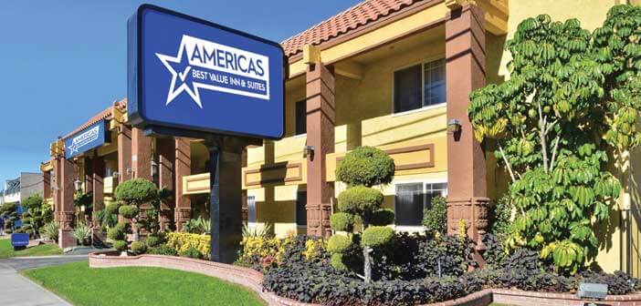 Americas Best Value Inn front exterior with a large brand sign in front